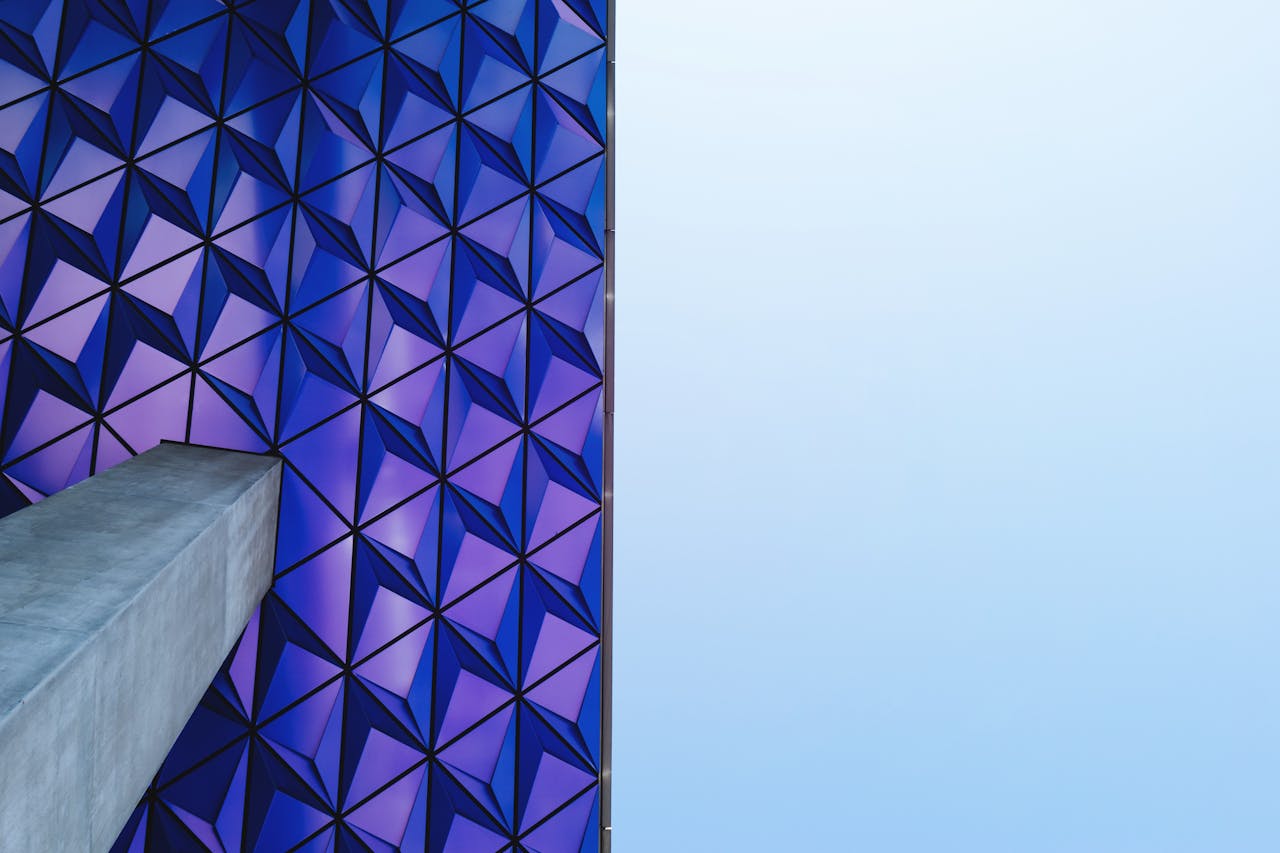 about-02 Futuristic geometric facade with blue and purple patterns in Toronto.